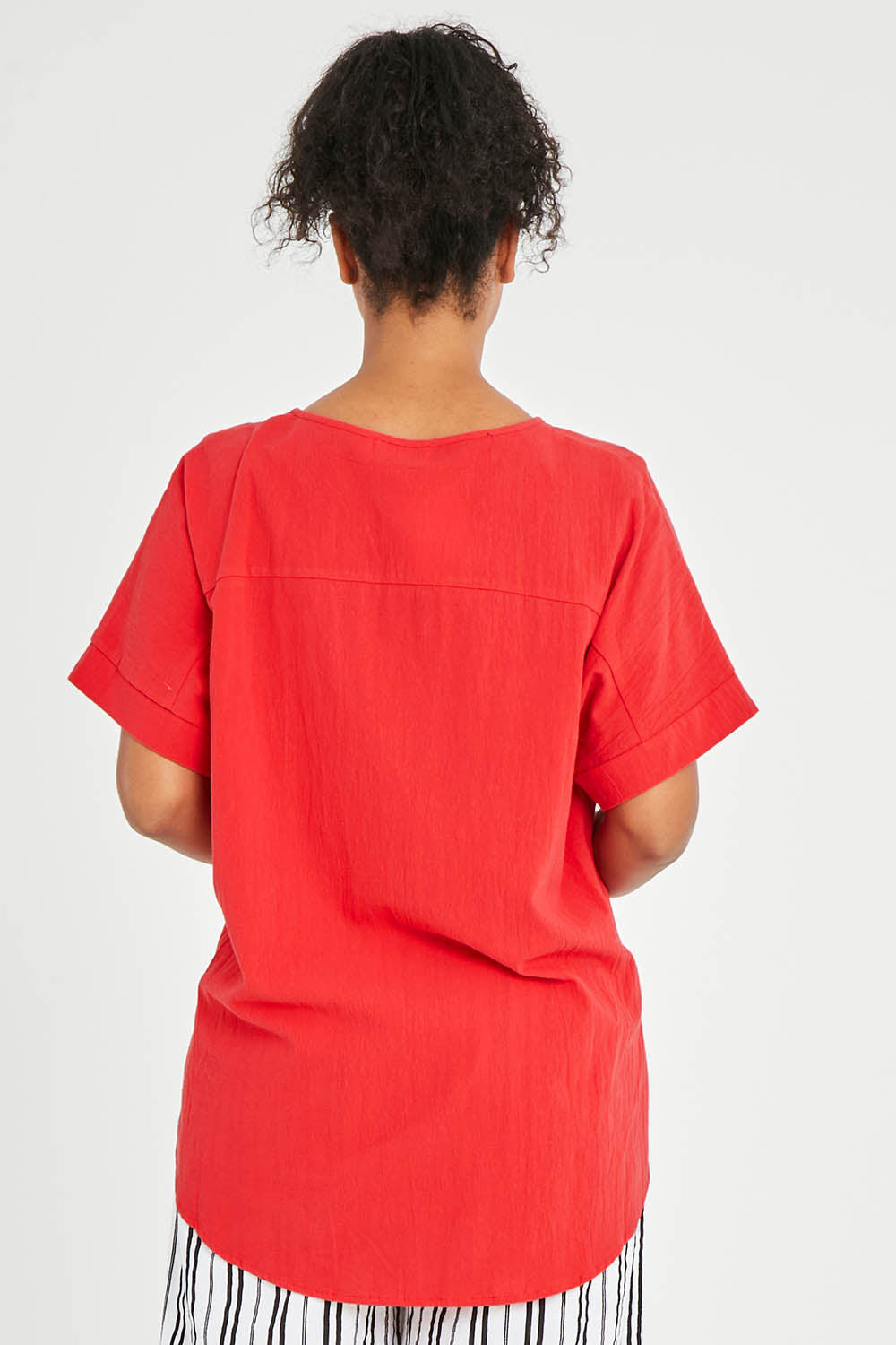 Model Noli wearing size 14 of The Relaxed Fit Woven Tee in colour Red (Red), from the back
