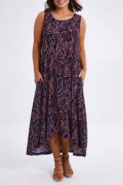 Model Monique wearing size 14 of The High Low Summer Dress in colour Navyred (Blue), from the front, cropped image