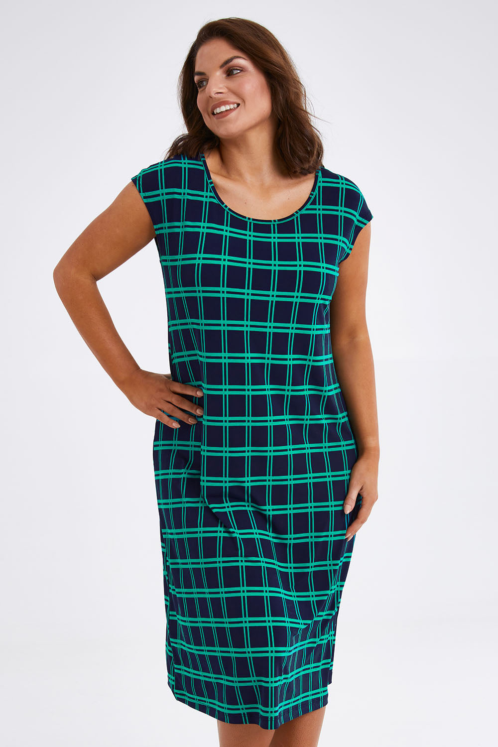 Model Monique wearing size 14 of The Keepers Check Sun Dress in colour Navycheck (Blue), from the front, cropped image