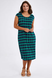 Model Monique wearing size 14 of The Keepers Check Sun Dress in colour Navycheck (Blue), from the front, showing the whole outfit