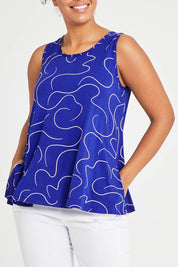 Model Noli wearing size 14 of The Printed Summer Tank in colour Royalblue (Blue), from the front, cropped image