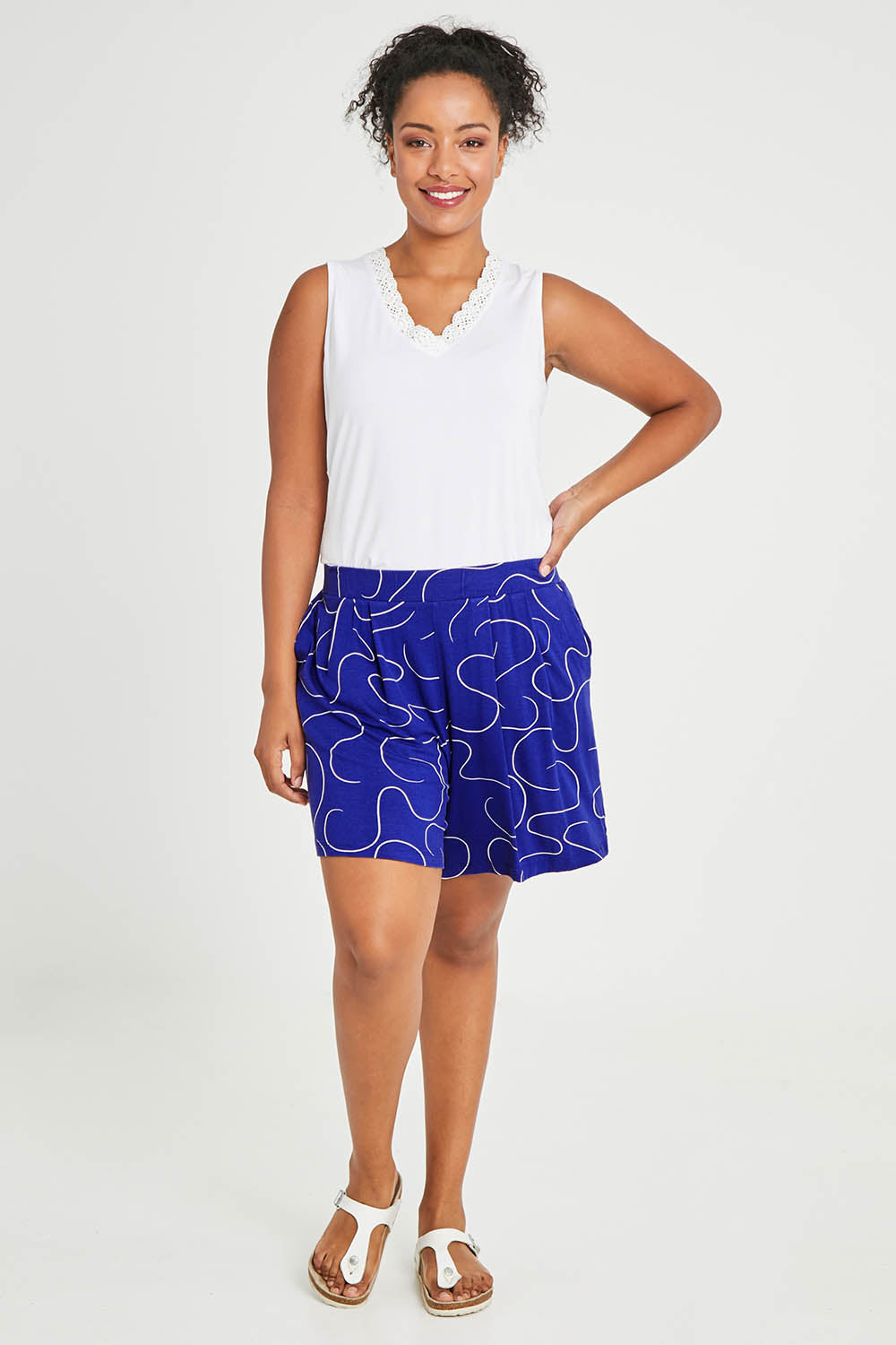 Model Noli wearing size 14 of The Printed Summer Jersey Short in colour Royalblue (Blue), from the front, showing the whole outfit