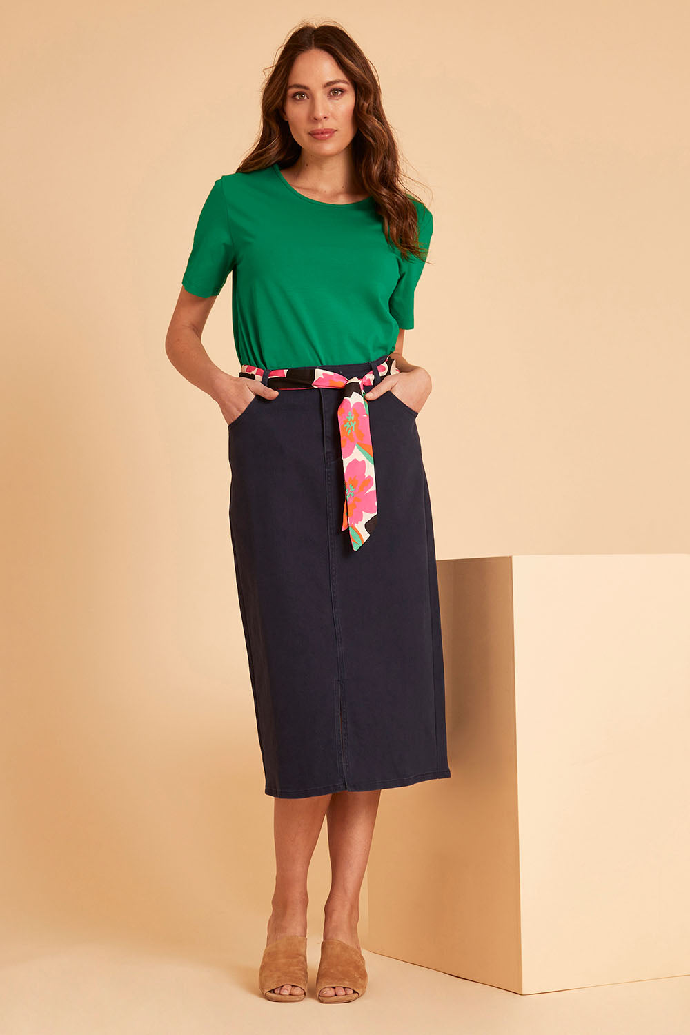 Model Madeline wearing size 10 of The 5 Pocket Denim Midi Skirt in colour Navy (Blue), from the front, showing the whole outfit