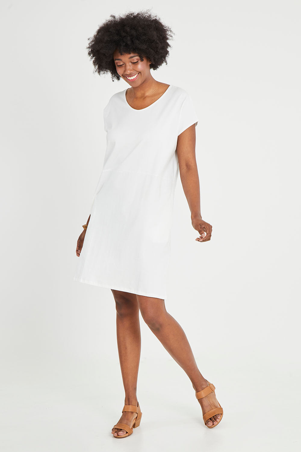 Model Aiyana wearing size 10 of The Luxe Cotton Tee Dress in colour White (White), from the front, showing the whole outfit