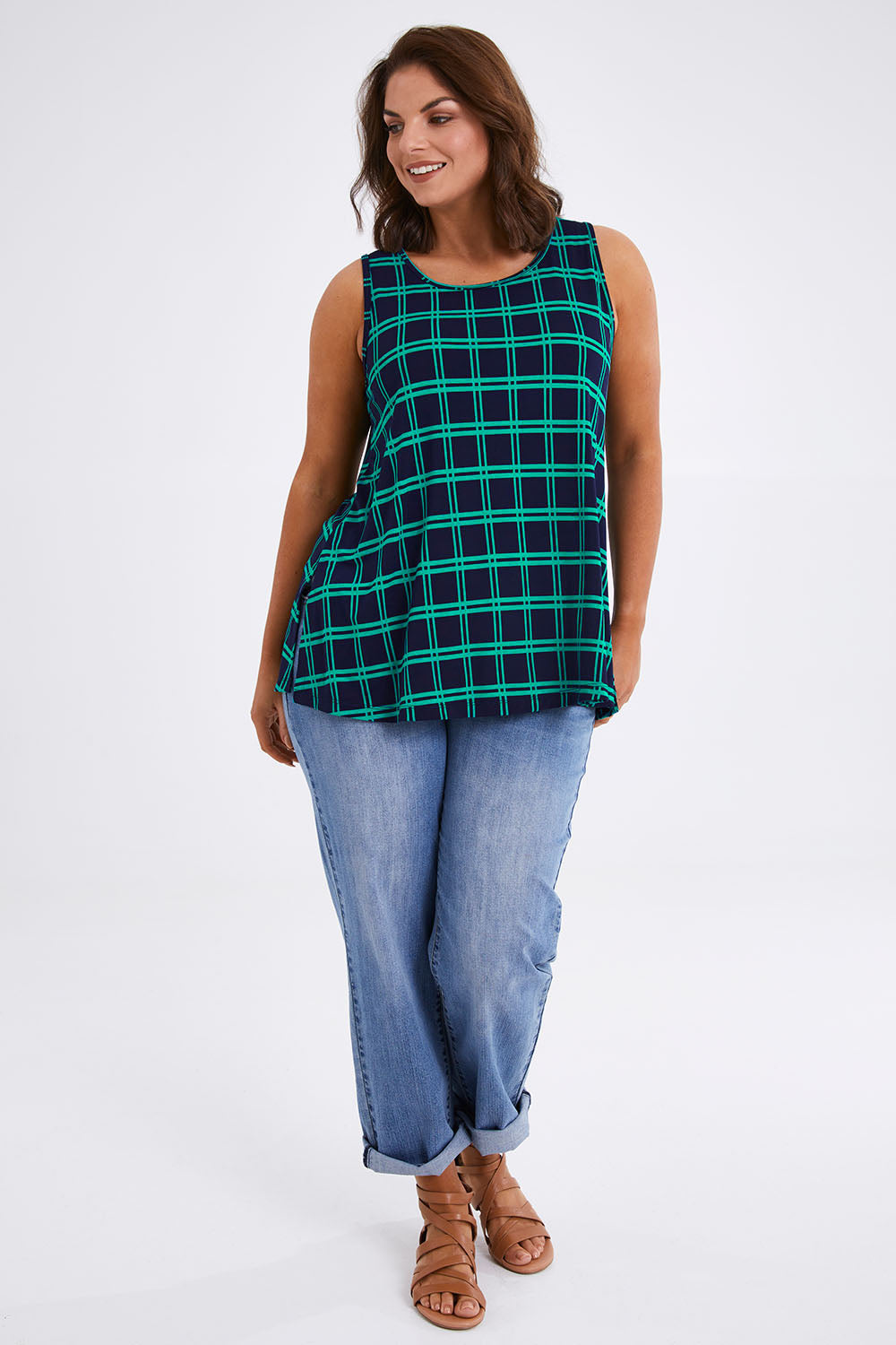 Model Monique wearing size 14 of The Printed Drape Tank in colour Navycheck (Blue), from the front, showing the whole outfit