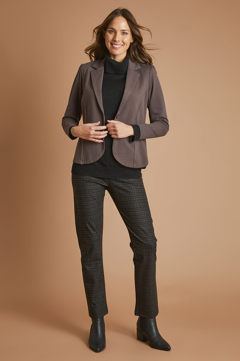 Model Madeline wearing size 10 of The Ponte Check Pant in colour Blackbrown (Black), from the front, showing the whole outfit