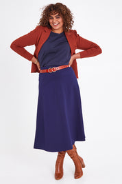 Model Anucia wearing size 14 of The Fit And Flare Ponte Skirt in colour Frenchnavy (Blue), from the front, showing the whole outfit