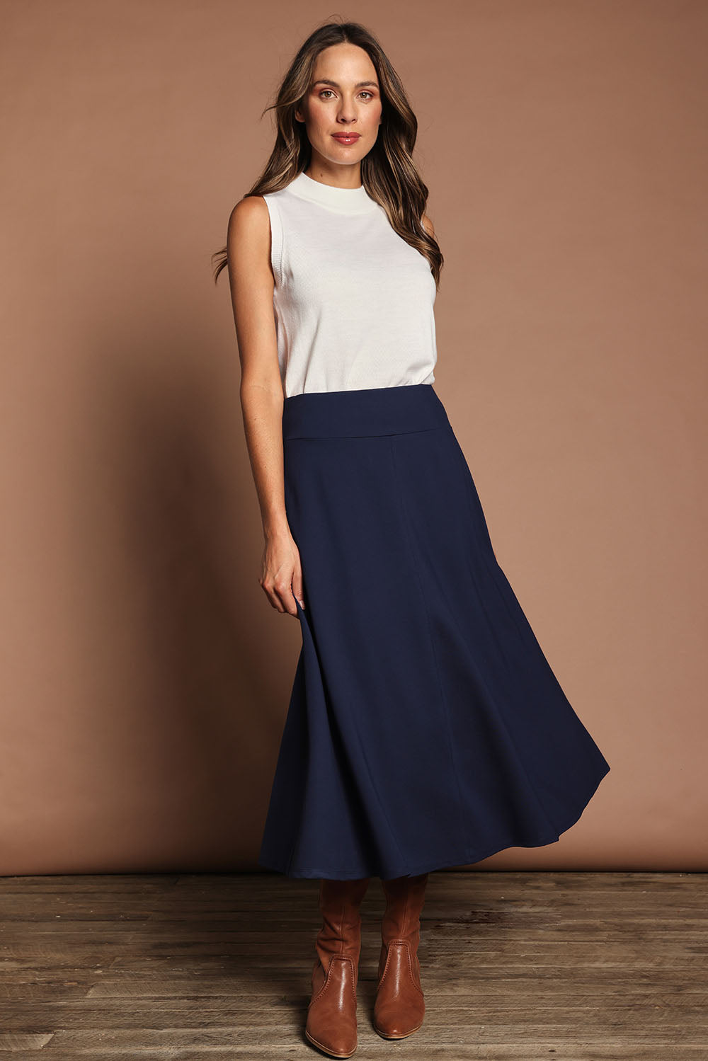 Model Madeline wearing size 10 of The Fit And Flare Ponte Skirt in colour Frenchnavy (Blue), from the front, showing the whole outfit