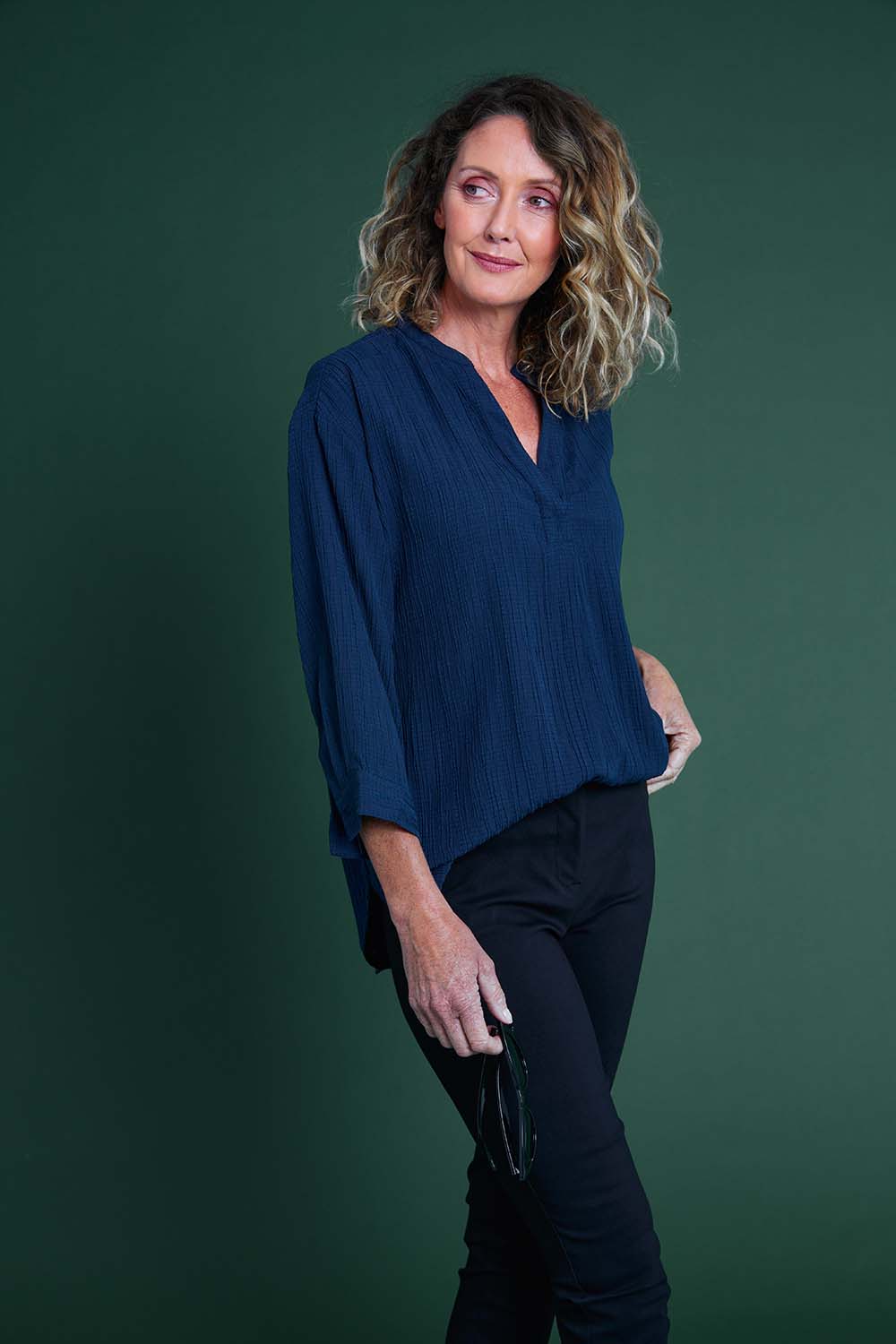 Model Emma wearing size 10 of The Nehru Collar Textured Top in colour Navy (Blue), from the front, cropped image