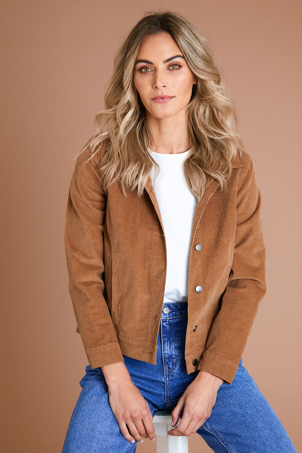 Model Alice wearing size 10 of The Cord Casual Jacket in colour Camel, from the front, showing the whole outfit