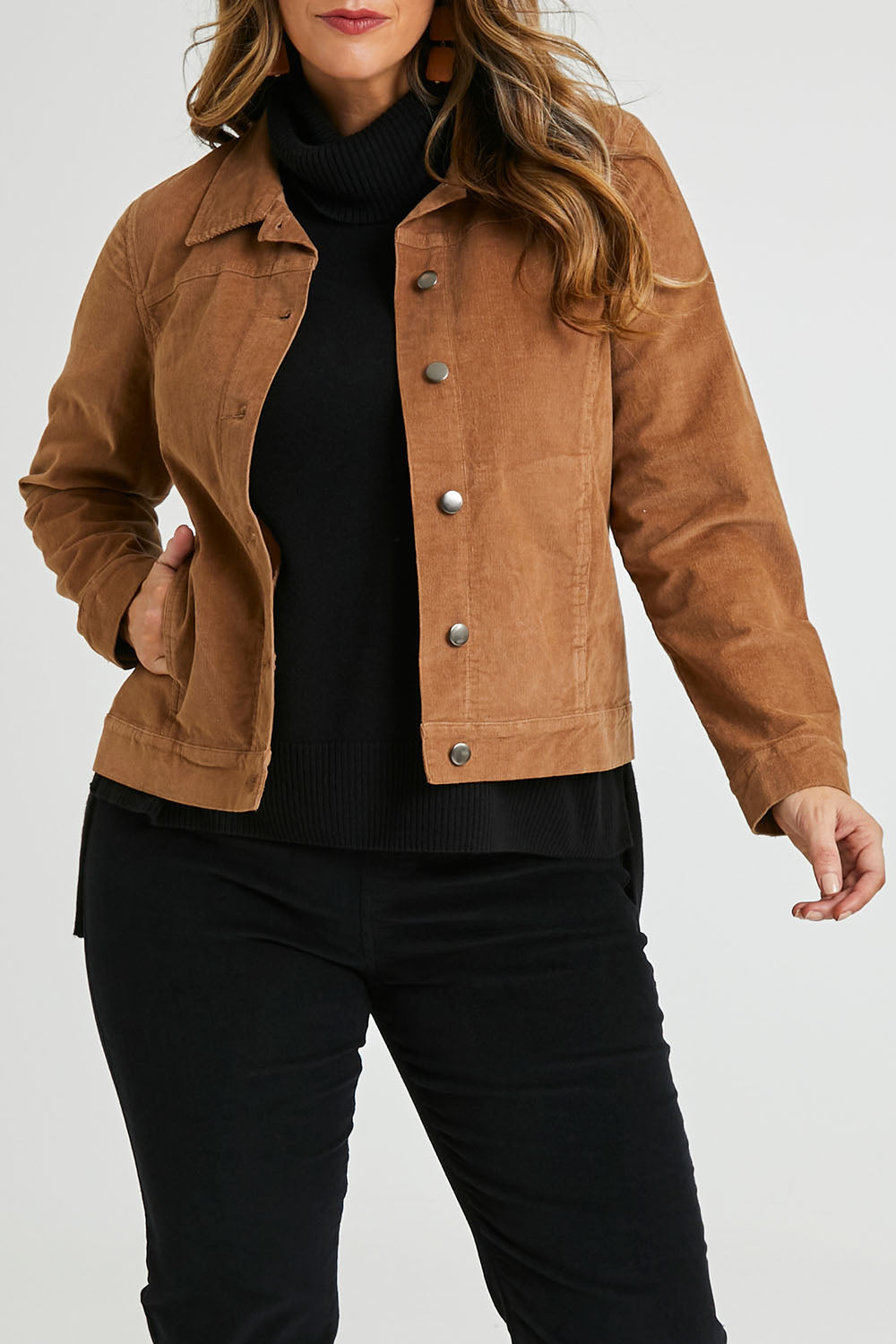 Model Laura wearing size 14 of The Cord Casual Jacket in colour Camel, from the front, cropped image