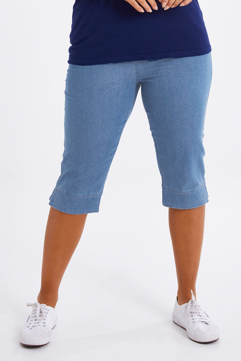 Model Monique wearing size 14 of The Cotton Blend 3/4 Pant in colour Chambray (Blue), from the front, cropped image