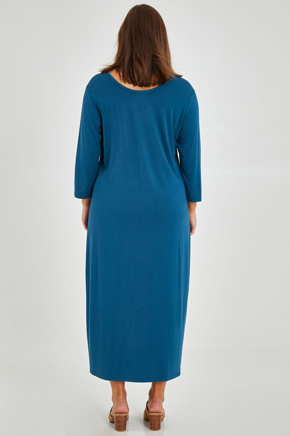 Model Monique wearing size 14 of The Bamboo 3/4 Sleeve Maxi Dress in colour Blueberry (Blue), from the back