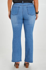 Model Monique wearing size 14 of The Contour Bootleg Jean in colour Lightdenim (Blue), from the back