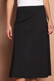 Model Madeline wearing size 10 of The Fit & Flare Summer Skirt in colour Black (Black), from the front, cropped image