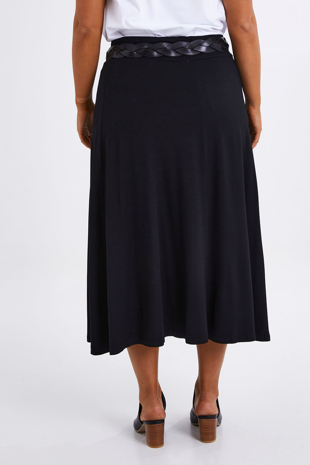 Model Monique wearing size 14 of The Fit & Flare Summer Skirt in colour Black (Black), from the back