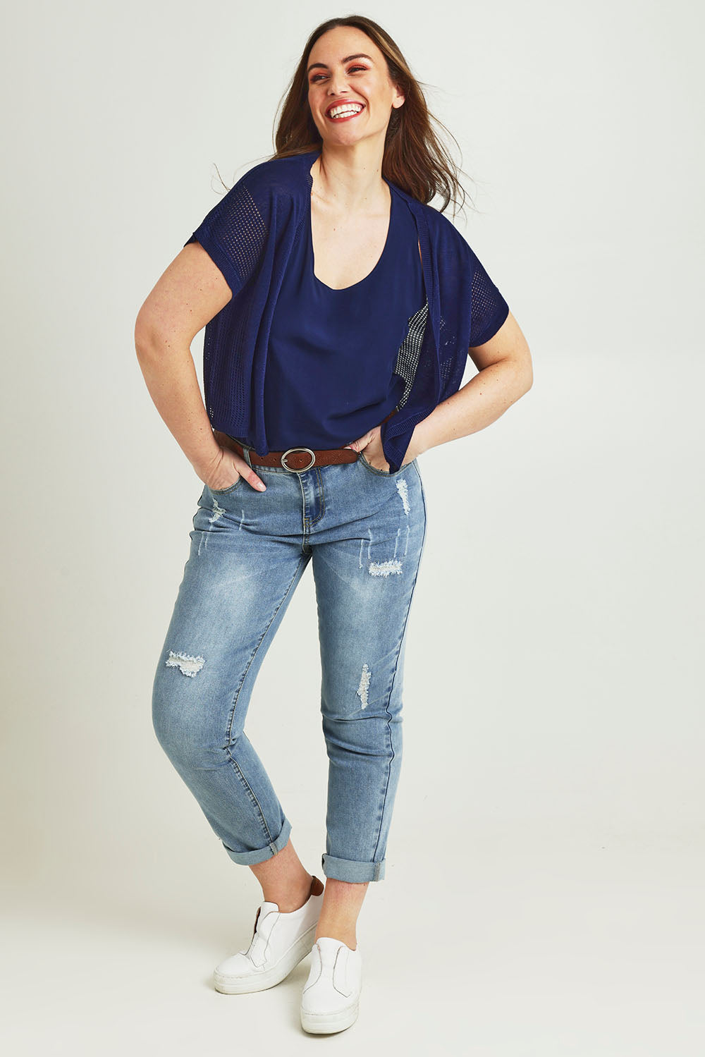 Model Jane wearing size L of The Short Sleeve Shrug in colour Clasicnavy (Blue), from the front, showing the whole outfit