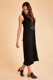 Model Madeline wearing size 10 of The Luxe Sleeveless Maxi Dress in colour Black (Black), from the front, showing the whole outfit