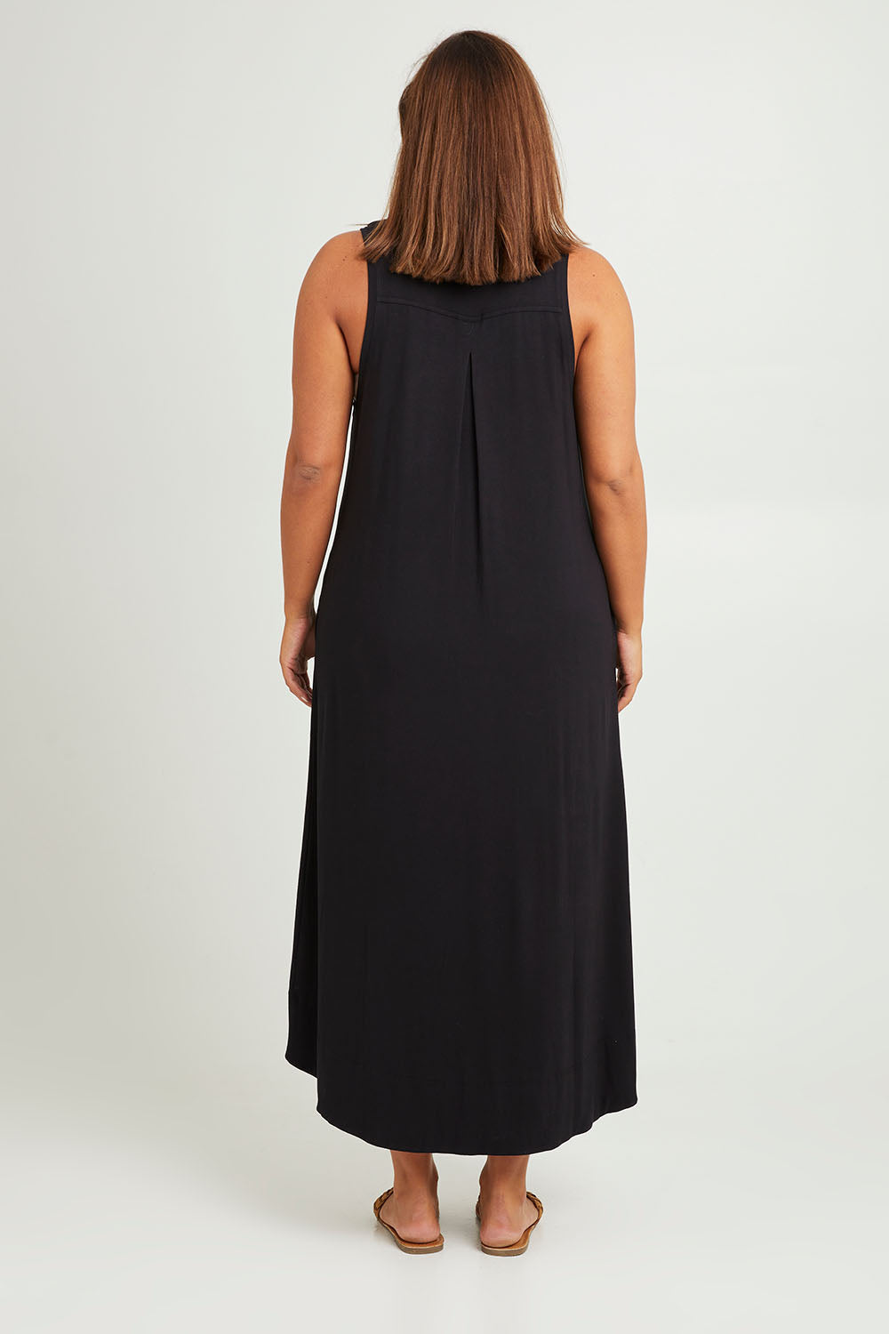 Model Monique wearing size 14 of The Luxe Sleeveless Maxi Dress in colour Black (Black), from the back