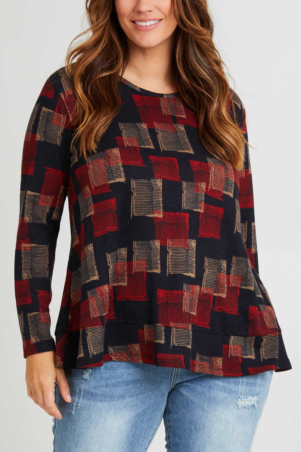 Model Laura wearing size 14 of The Printed Knit Swing Tee in colour Navycheck (Blue), from the front, cropped image