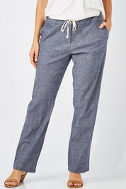 Model Anna wearing size 8 of The Drawstring Linen Pant in colour Navy (Blue), from the front, cropped image