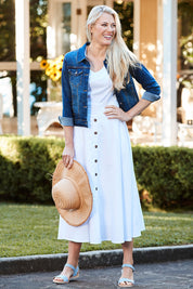 Model Denniel wearing size 10 of The Button Up Midi Skirt in colour White (White), from the front, showing the whole outfit