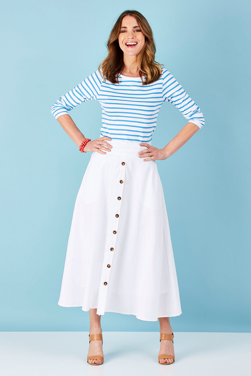 Model Helen wearing size 8 of The Button Up Midi Skirt in colour White (White), from the front, showing the whole outfit