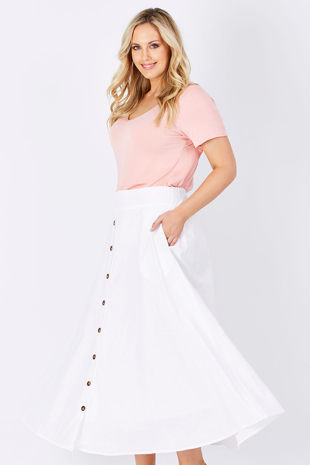 Model Jess wearing size 12 of The Button Up Midi Skirt in colour White (White)