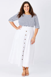 Model Mae wearing size 16 of The Button Up Midi Skirt in colour White (White), from the front, showing the whole outfit