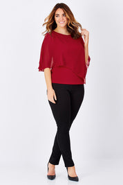 Model Laura wearing size 12 of The Overlay Top in colour Red (Red), from the front, showing the whole outfit