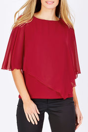 Model Maddy wearing size 10 of The Overlay Top in colour Red (Red), from the front, cropped image