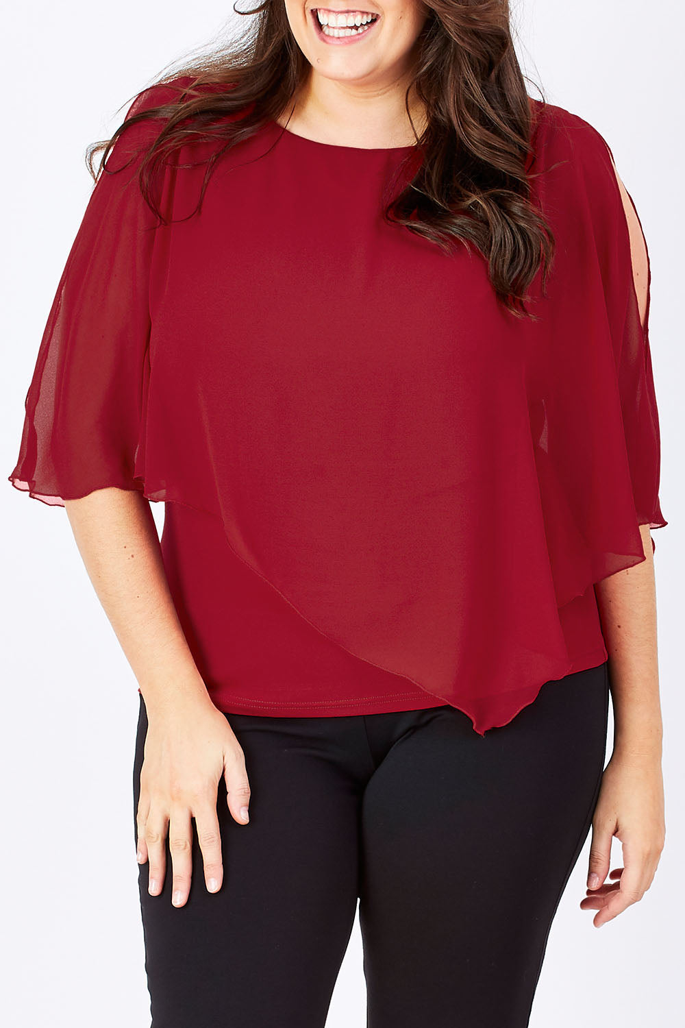 Model Mae wearing size 16 of The Overlay Top in colour Red (Red), from the front, cropped image