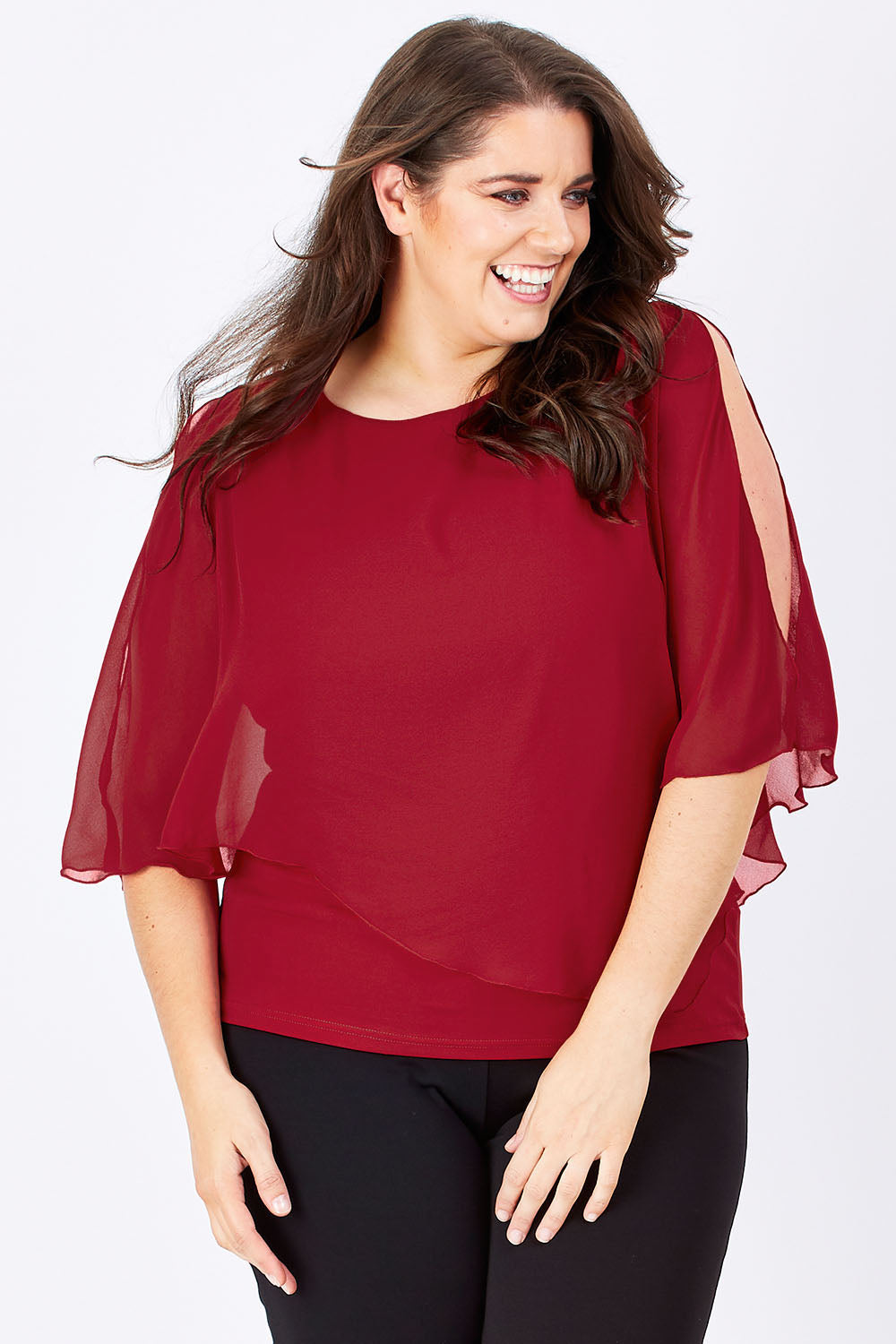 Model Mae wearing size 16 of The Overlay Top in colour Red (Red), from the front, cropped image