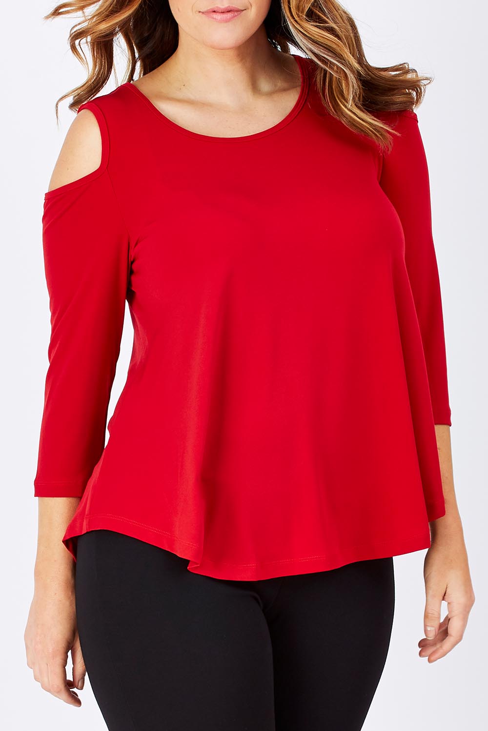 Model Laura wearing size 14 of The Cut Out Shoulder Top in colour Red (Red), from the front, cropped image