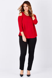 Model Laura wearing size 14 of The Cut Out Shoulder Top in colour Red (Red), from the front, showing the whole outfit