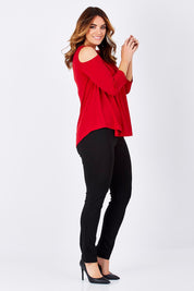 Model Laura wearing size 14 of The Cut Out Shoulder Top in colour Red (Red), from the front, showing the whole outfit