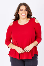 Model Mae wearing size 16 of The Cut Out Shoulder Top in colour Red (Red), from the front, cropped image