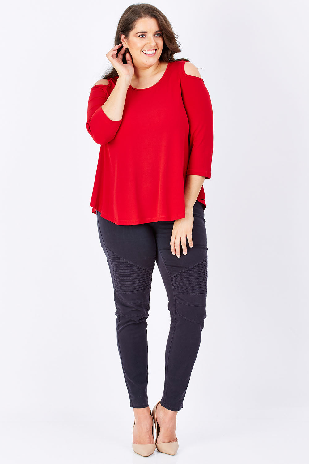 Model Mae wearing size 16 of The Cut Out Shoulder Top in colour Red (Red), from the front, showing the whole outfit
