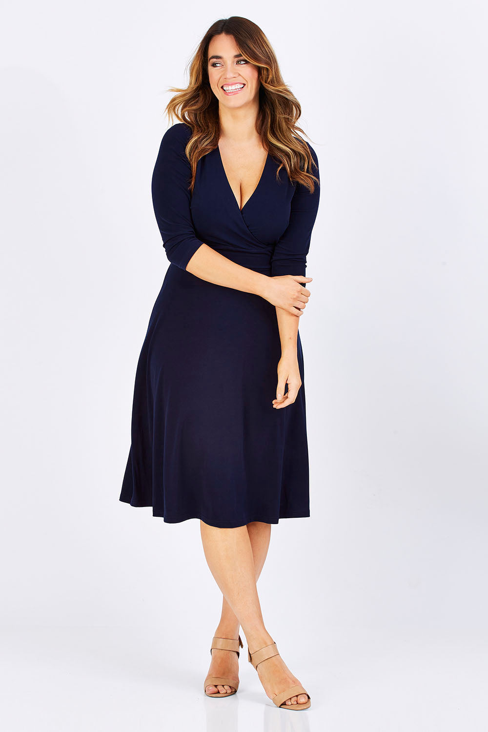 Model Laura wearing size 12 of The 3/4 Sleeve Jersey Wrap Dress in colour Navy (Blue), from the front, showing the whole outfit