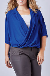 Model Kate wearing size 16 of The Cross Over Blouse in colour RoyalBlue (Blue), from the front, cropped image