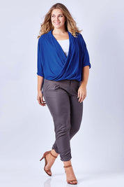 Model Kate wearing size 16 of The Cross Over Blouse in colour RoyalBlue (Blue), from the front, showing the whole outfit