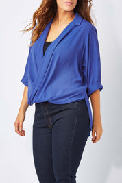 Model Laura wearing size 12 of The Cross Over Blouse in colour RoyalBlue (Blue), from the front, cropped image