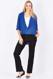 Model Maddy wearing size 10 of The Cross Over Blouse in colour RoyalBlue (Blue), from the front, showing the whole outfit