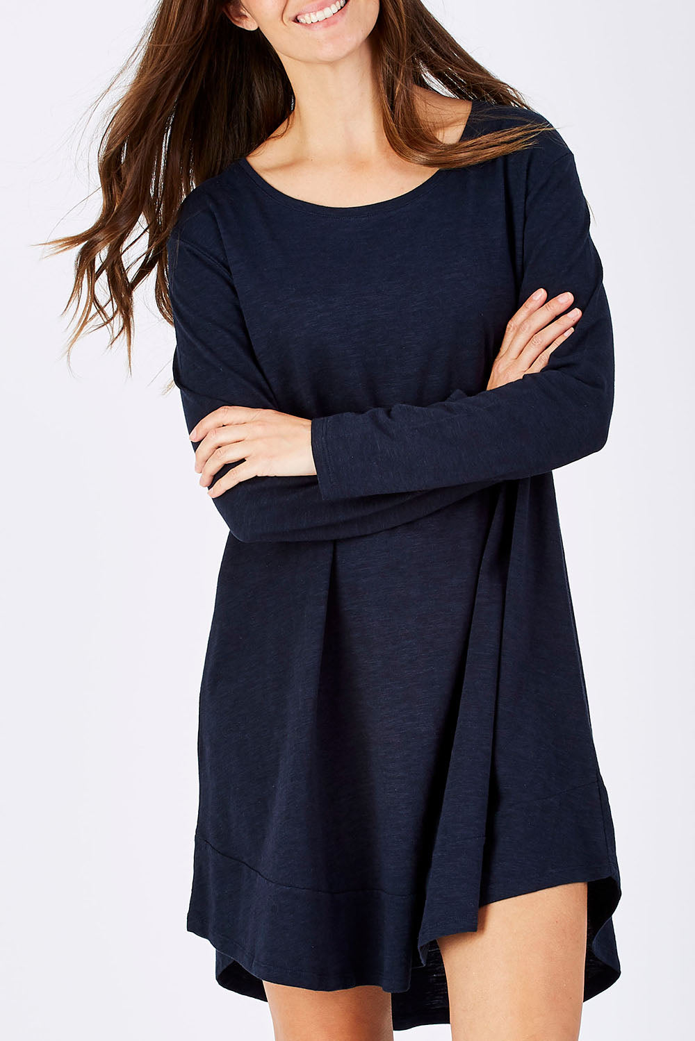 Model Anna wearing size 10 of The Long Sleeve Swing Dress in colour Navy (Blue), from the front, cropped image