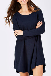 Model Anna wearing size 10 of The Long Sleeve Swing Dress in colour Navy (Blue), from the front, cropped image