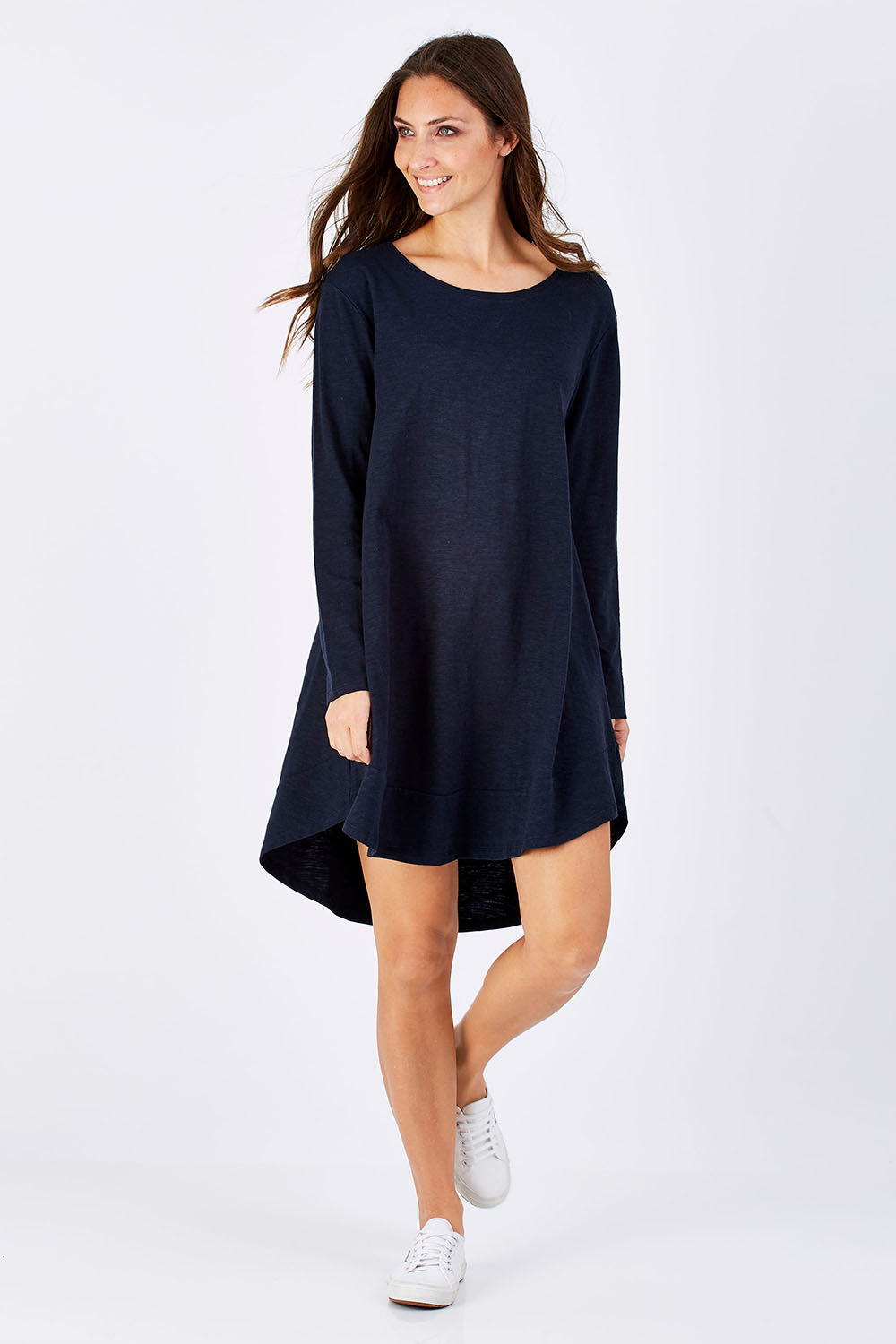 Model Anna wearing size 10 of The Long Sleeve Swing Dress in colour Navy (Blue), from the front, showing the whole outfit