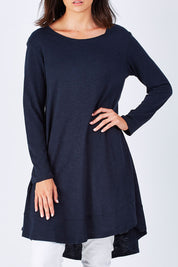 Model Perrie wearing size 10 of The Long Sleeve Swing Dress in colour Navy (Blue), from the front, cropped image
