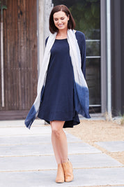 Model Perrie wearing size 10 of The Long Sleeve Swing Dress in colour Navy (Blue), from the front, showing the whole outfit