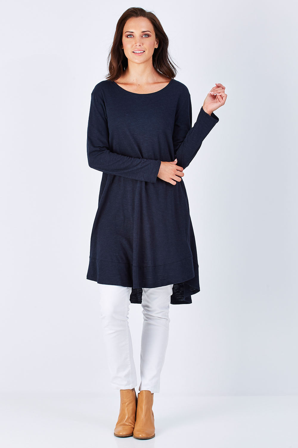 Model Perrie wearing size 10 of The Long Sleeve Swing Dress in colour Navy (Blue), from the front, showing the whole outfit
