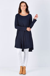 Model Perrie wearing size 10 of The Long Sleeve Swing Dress in colour Navy (Blue), from the front, showing the whole outfit